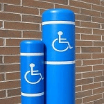 Two Blue and White Poles Featuring a Wheelchair Symbol